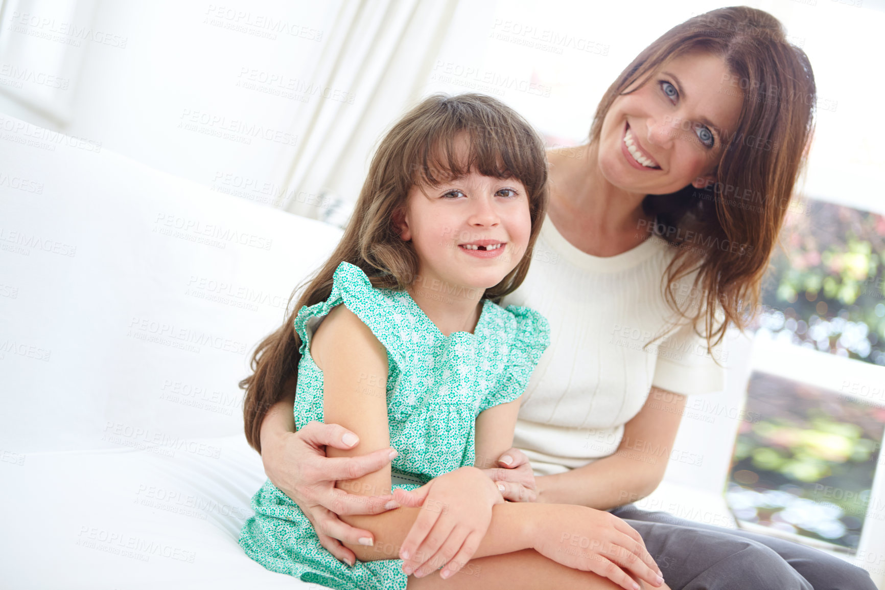 Buy stock photo Portrait of a cute little girl spending time with her mother at home