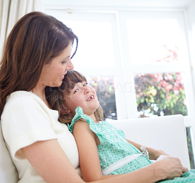 Buy stock photo Portrait of a cute little girl spending time with her mother at home