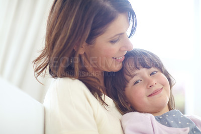 Buy stock photo Shot of a loving mother and daughter spending time together at home