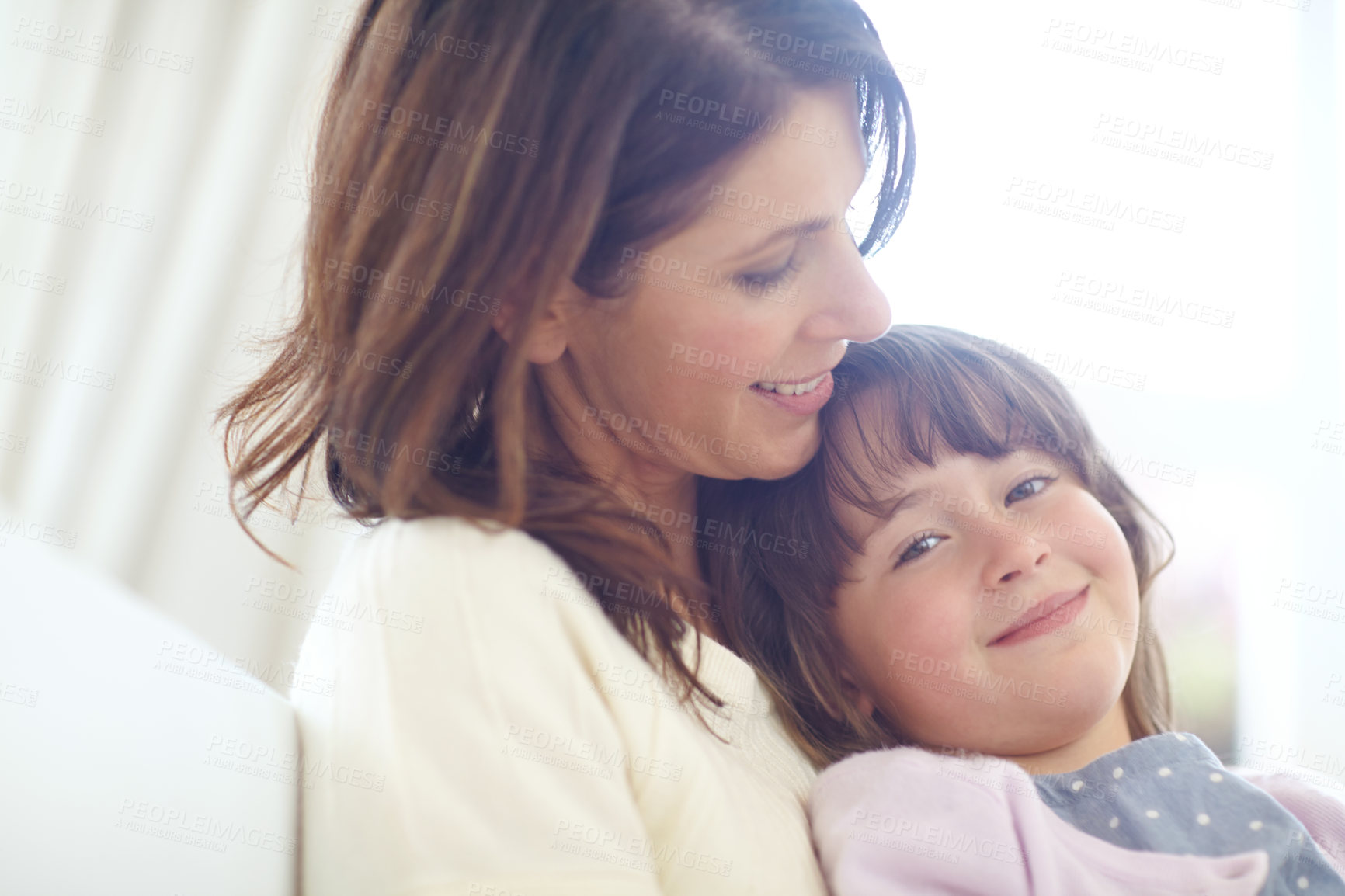 Buy stock photo Shot of a loving mother and daughter spending time together at home