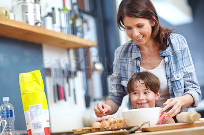 Buy stock photo Shot of a mother and daughter baking together