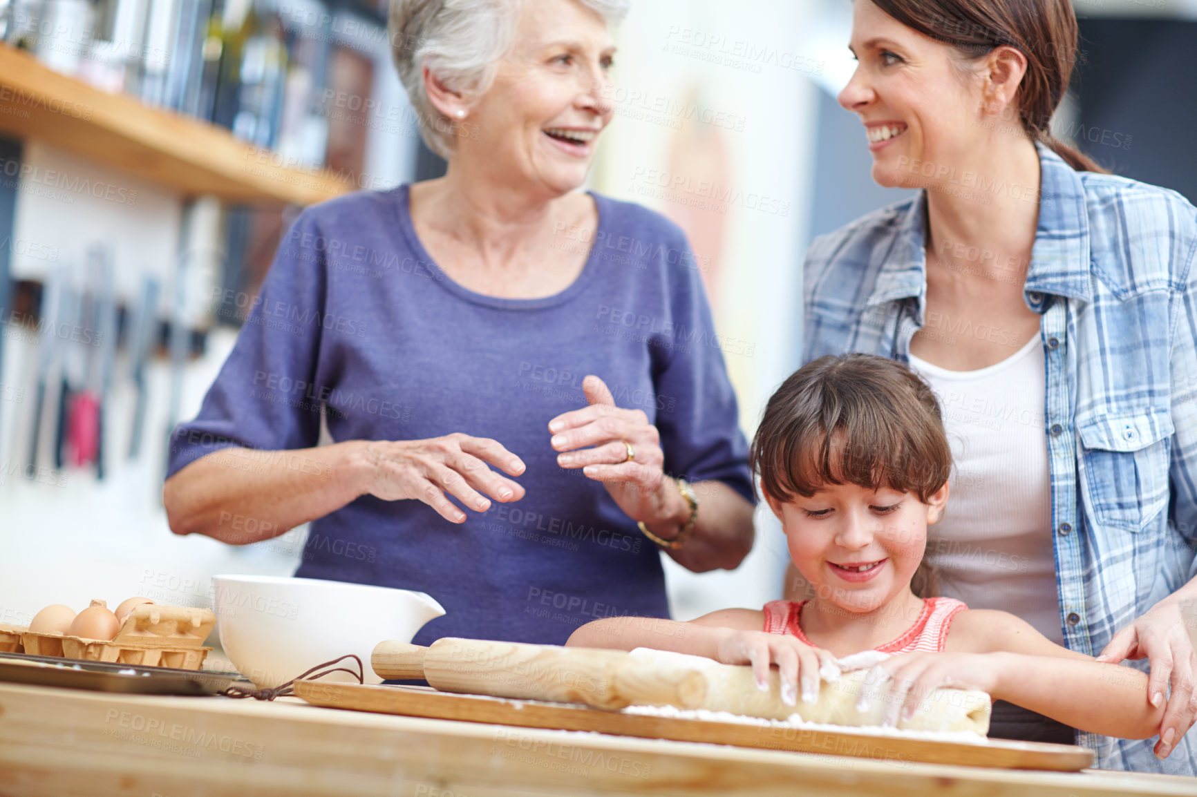 Buy stock photo Shot of a three generational family baking together