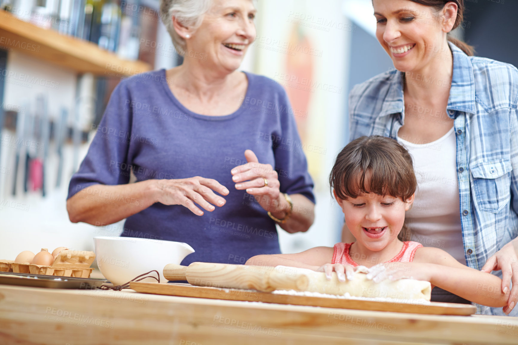 Buy stock photo Shot of a three generational family baking together