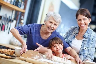 Buy stock photo Portrait of a three generational family baking together