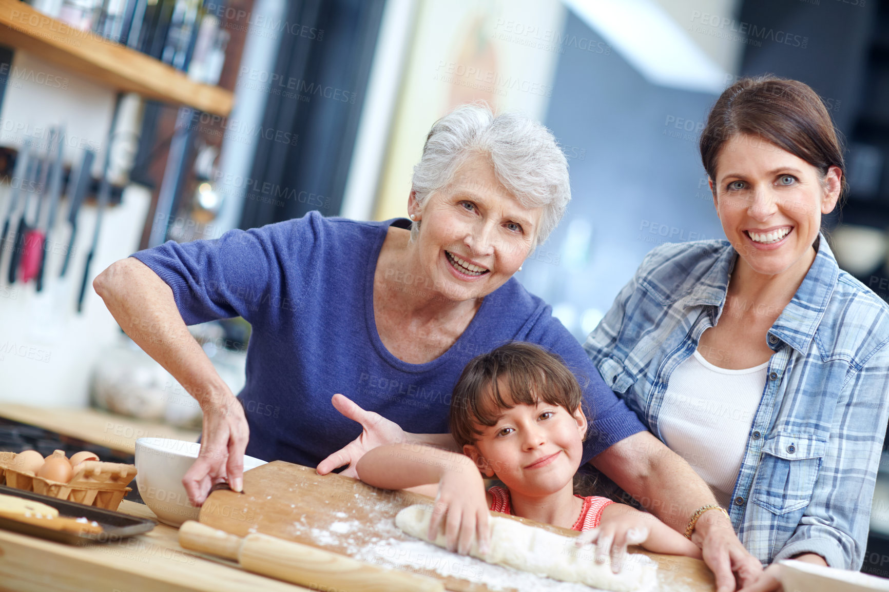 Buy stock photo Portrait of a three generational family baking together