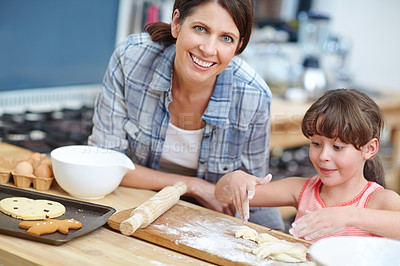 Buy stock photo Shot of a mother and daughter baking together