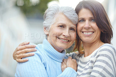 Buy stock photo Portrait of a senior woman standing outdoors with her beautiful daughter