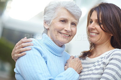 Buy stock photo Portrait of a senior woman standing outdoors with her beautiful daughter