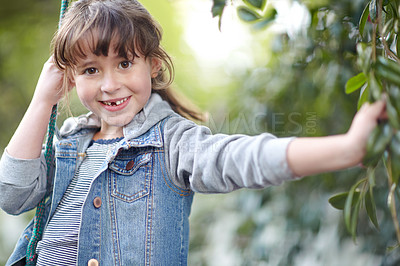 Buy stock photo Shot of a cute little girl playing outdoors