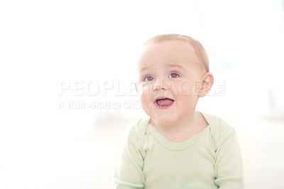 Buy stock photo Shot of an adorable little boy sitting on the floor