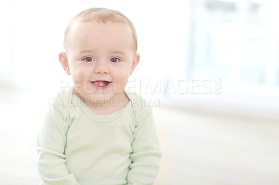 Buy stock photo Shot of an adorable little boy sitting on the floor