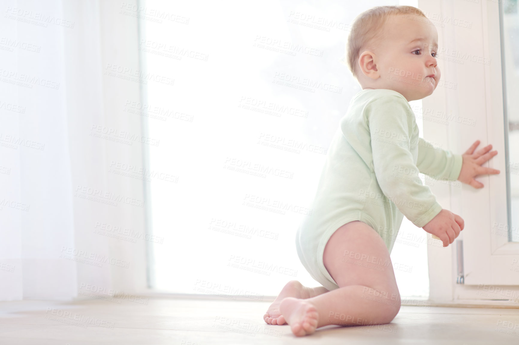 Buy stock photo Crawling, baby and boy in home for development, standing attempt and movement practice for motor skills. Childhood, first steps and infant with balance for growth, learning coordination and milestone