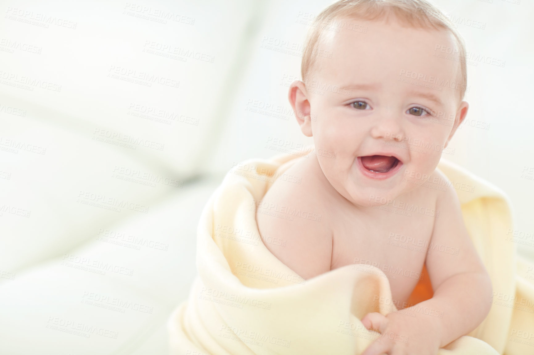 Buy stock photo Shot of a cute little baby boy wrapped in his blanket