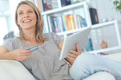 Buy stock photo Senior woman on sofa, credit card and tablet for online shopping, ecommerce and digital payments. Mature female, lady and search internet for transactions, daily deals and connection in living room