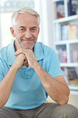 Buy stock photo Portrait of a handsome mature man relaxing at home