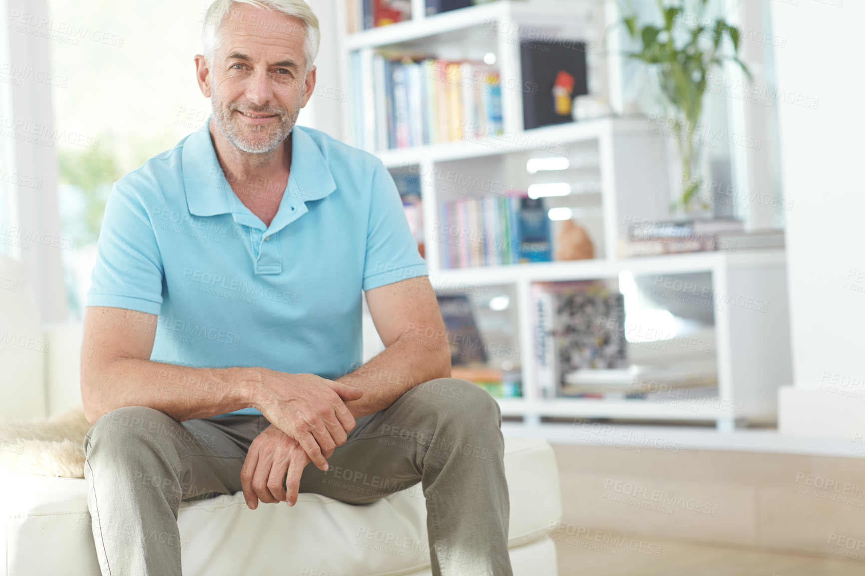 Buy stock photo Cropped portrait of a handsome mature man relaxing at home