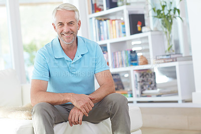 Buy stock photo Senior man, sitting and smile in living room relaxing at home on sofa enjoying happy retirement. Portrait of elderly male smiling in relax on couch for holiday, weekend or satisfaction at the house