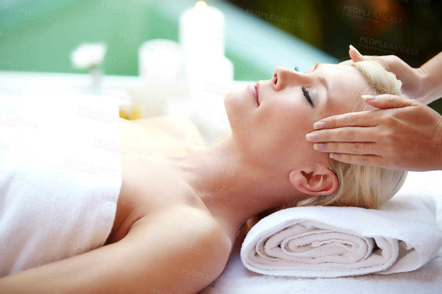 Buy stock photo Shot of a beautiful woman enjoying a head massage at a spa