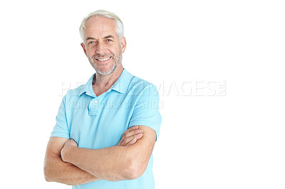 Buy stock photo Studio portrait of a handsome mature man standing with his arms crossed