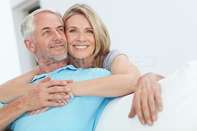 Buy stock photo Senior couple, hug and happy portrait with love at home for trust, care and support for retirement. Commitment of man and woman in a healthy marriage and lifestyle with security on living room couch
