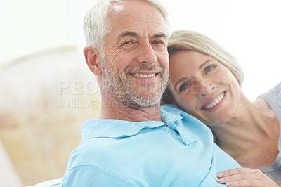 Buy stock photo Senior couple, retirement and portrait in their home with love, care and support from life insurance. Commitment of a man and woman in a healthy and happy marriage with security on living room couch