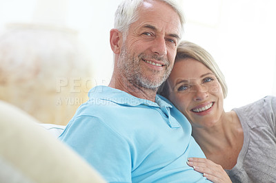 Buy stock photo Portrait of a loving mature couple relaxing on the sofa at home