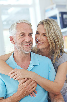 Buy stock photo Senior couple, happy and laughing in their home with love, care and support for retirement lifestyle. Commitment of a funny man and woman in a marriage with trust and security on a living room couch