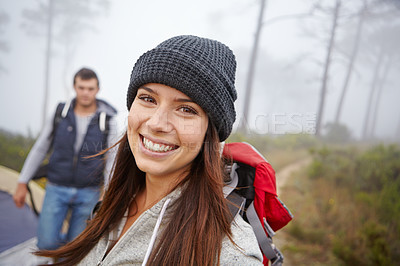 Buy stock photo Portrait of an attractive young woman on a hiking trip with her boyfriend