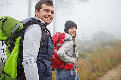 Buy stock photo Portrait of a handsome young man out hiking with his girlfriend