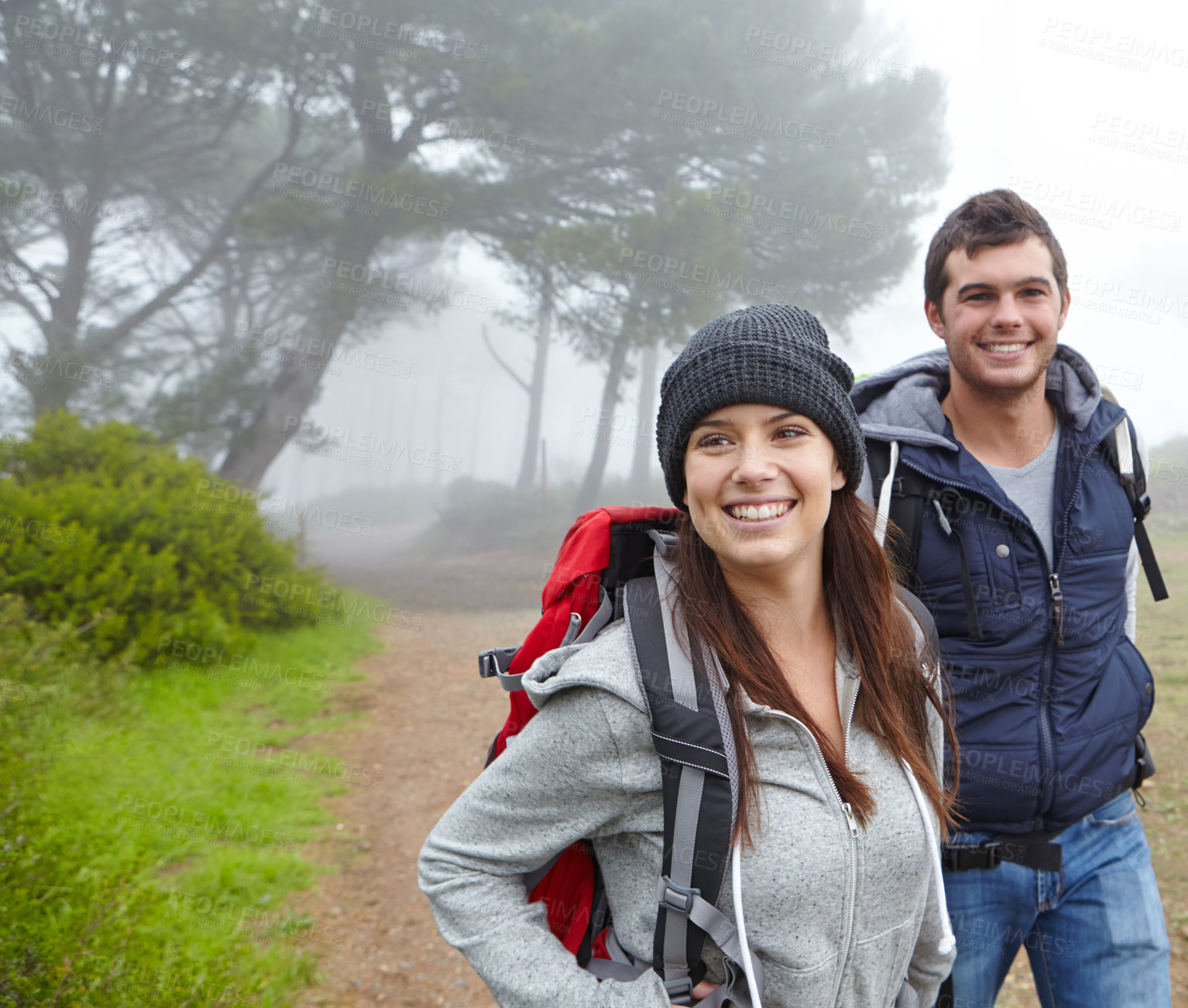 Buy stock photo Shot of a beautiful young woman on a hiking trip with her boyfriend