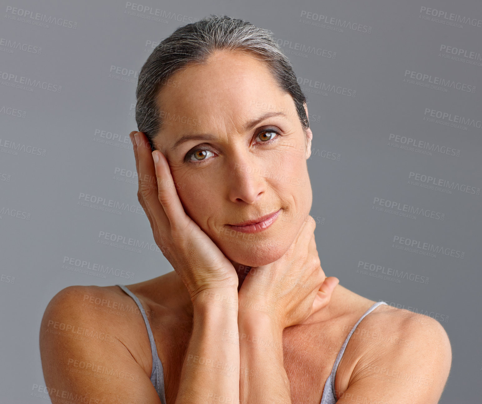 Buy stock photo Mature woman, skincare and studio portrait for beauty, confident collagen and gray background. Female person, hygiene and results of antiaging treatment, cosmetics and smooth touch for dermatology