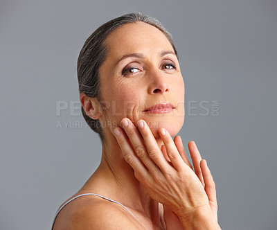 Buy stock photo Mature woman, studio and smile for skincare on portrait with confidence for routine in gray background. Female person, facial and satisfied on antiaging treatment and cosmetics for glow and self care