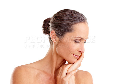 Buy stock photo Studio shot of a beautiful mature woman posing against a white background