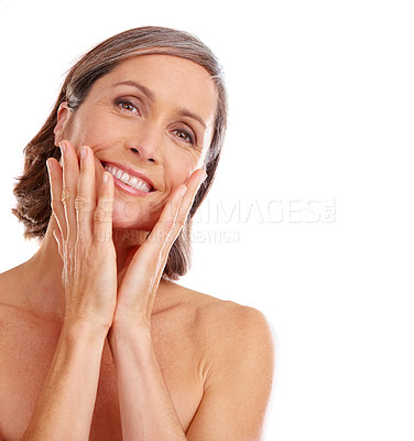 Buy stock photo Studio portrait of a beautiful mature woman posing against a white background