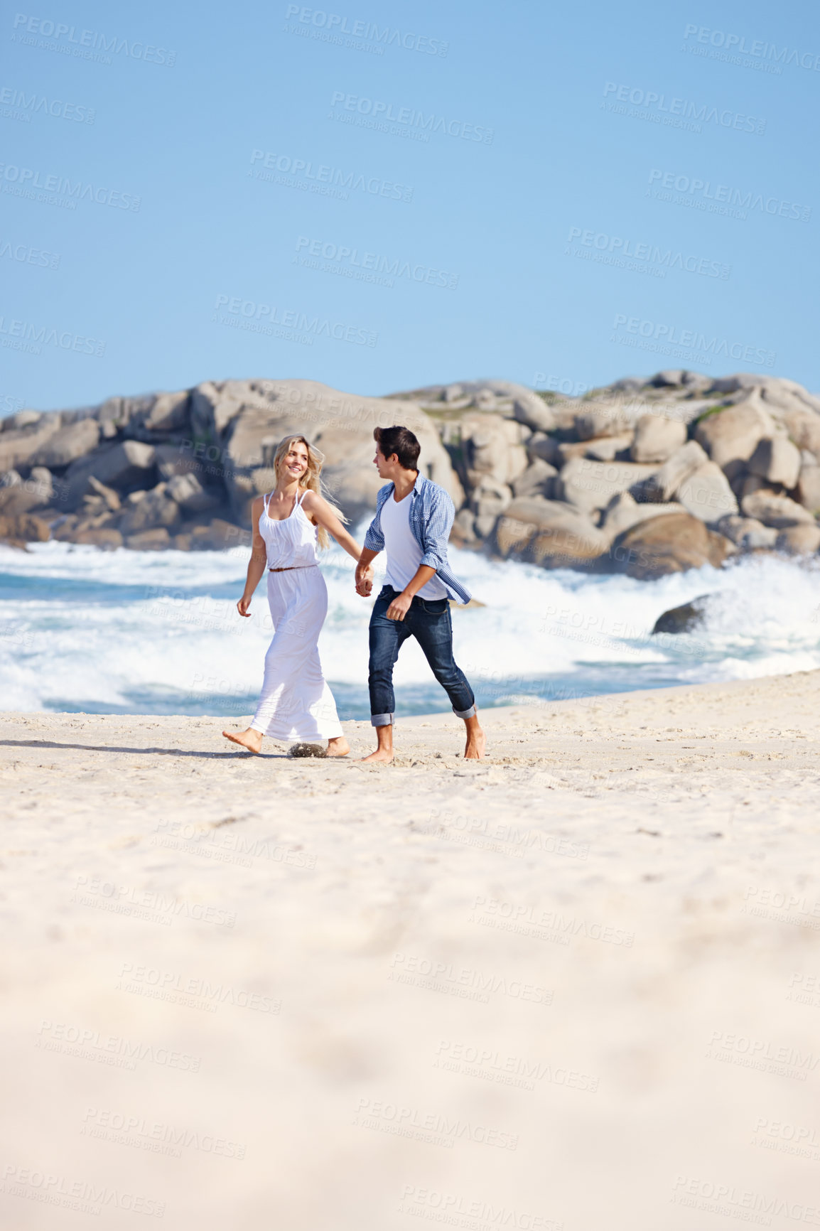 Buy stock photo Couple, holding hands or walking on beach for love, travel or summer vacation. Happy woman, man or gesture at ocean for trust, commitment or security in relationship on holiday with sky space in Bali