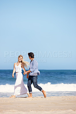 Buy stock photo Couple, holding hands or travel on beach for love, freedom or summer vacation. Happy woman, man or gesture at ocean for trust, commitment or security in relationship on holiday with sky space in Bali