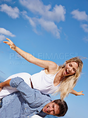 Buy stock photo Couple, piggyback and excited at beach for travel, love or summer vacation. Happy man, woman and airplane at ocean for freedom, support or commitment in healthy relationship with sky space in Bali