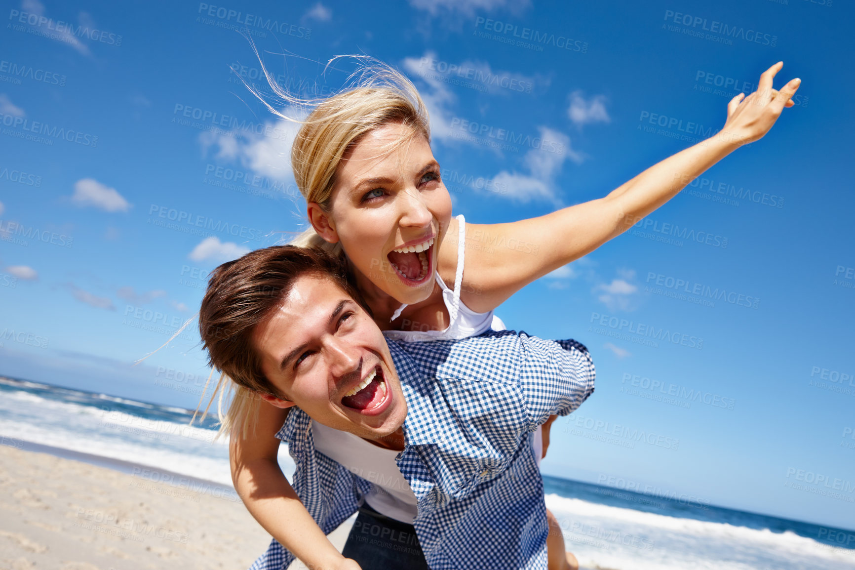 Buy stock photo Freedom, carrying and smile of couple, sea and celebration of commitment, bonding and happy in vacation. Piggyback, man and woman on holiday, travel and together in nature, relationship and date