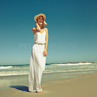 Buy stock photo Shot of a beautiful young woman enjoying a day at the beach