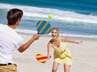 Buy stock photo Friends, tennis and beach play by waves together for fun, holiday or bonding with sports and exercise in nature. Happy people, game and Miami ocean with vacation, adventure and travel with trip