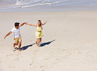 Buy stock photo Beach, holding hands and couple with love, travel and romance with vacation, relationship and bonding together. Ocean, seaside pr man with woman, marriage and adventure with journey, honeymoon or joy