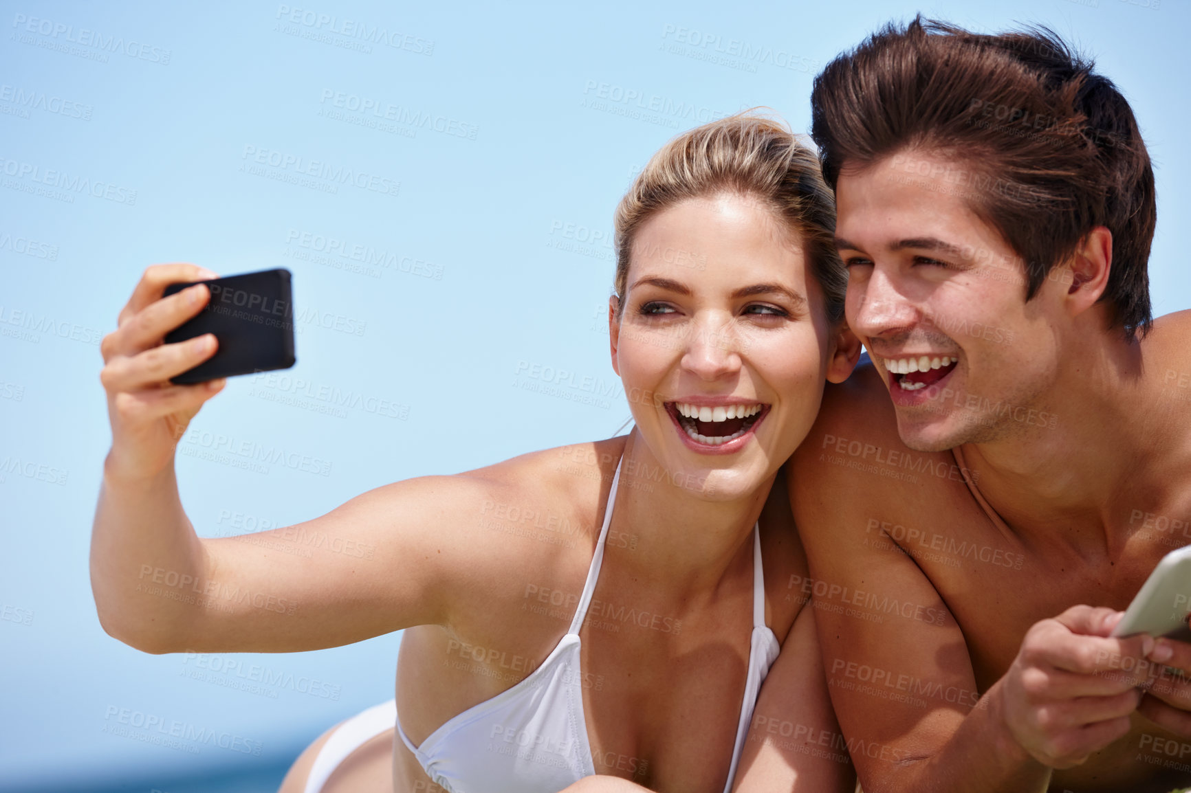 Buy stock photo Selfie, beach and bonding of couple, travel and peace for date in nature, blanket and holiday. Smile, moment and photography for memory at sea, outdoor and people in relationship, love and picture