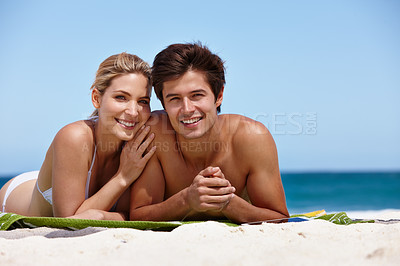 Buy stock photo Couple, portrait and happy on beach for travel, bonding and tropical holiday with smile and blue sky. Man, woman and relax outdoor for trip, love and vacation with sunshine, ocean and date on weekend