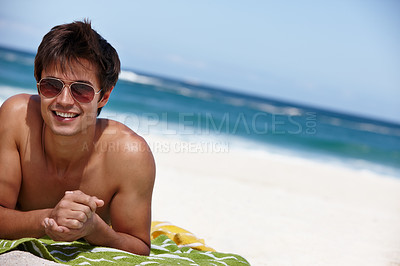 Buy stock photo Man, relax and travel to beach with sunglasses, sunbathing and ocean waves for happiness. Male person, outdoor and tropical resort for peace on island, tourist and holiday trip to Mauritius sand