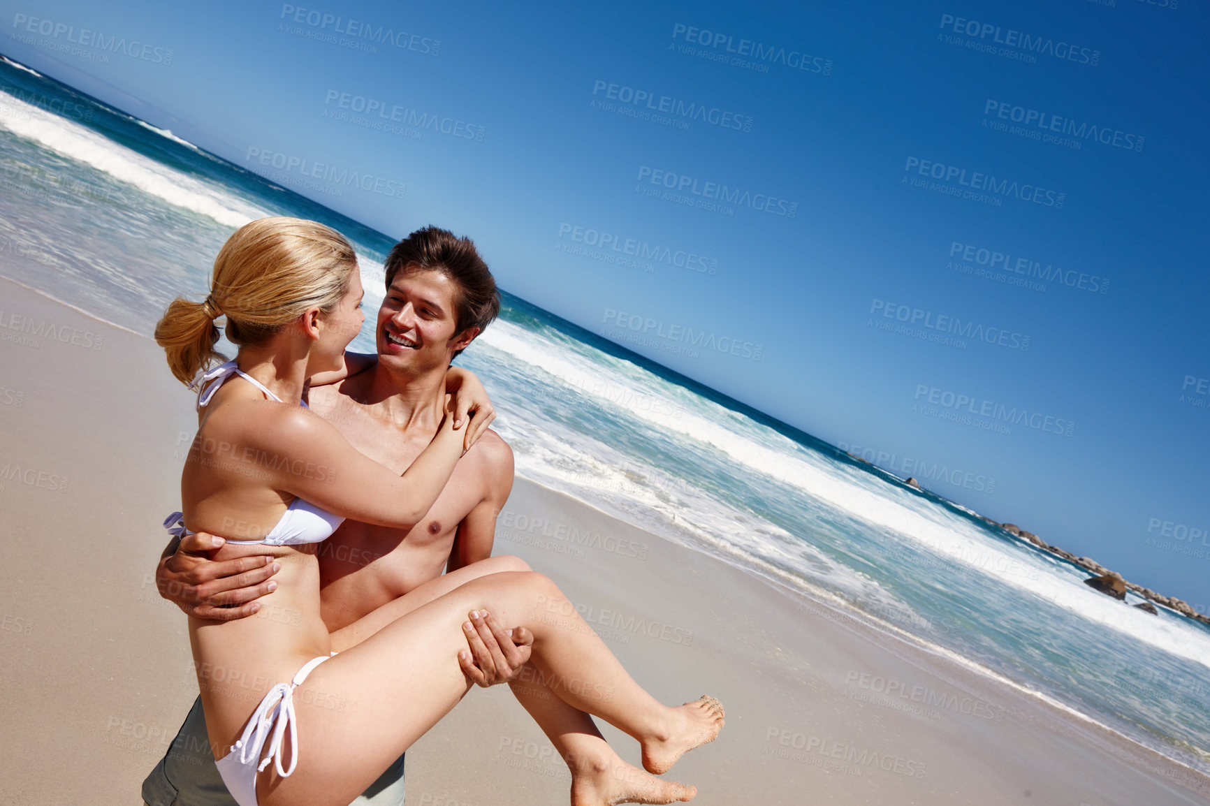 Buy stock photo Beach, carrying and fun for couple, nature and celebration of commitment, bonding and happy in relationship. Outdoor, man and woman on holiday, waves and together with smile, romance and date at sea