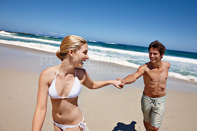 Buy stock photo Laugh, beach and happy couple holding hands on holiday, summer vacation or travel. Love, man and woman at ocean for support, romantic connection or excited for healthy relationship and walk on date