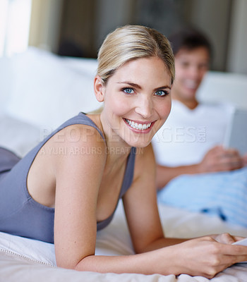 Buy stock photo Bedroom, woman and portrait with magazine for reading, information and relax with happy partner at home. House, couple and female person with smile for inspiration, ideas and print tips for marriage