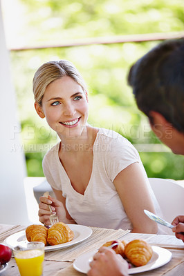 Buy stock photo Balcony, couple and happy with food for breakfast, hungry and bonding together on vacation in morning. Outdoor, man and woman with nutrition for eating, romance and commitment with smile at home