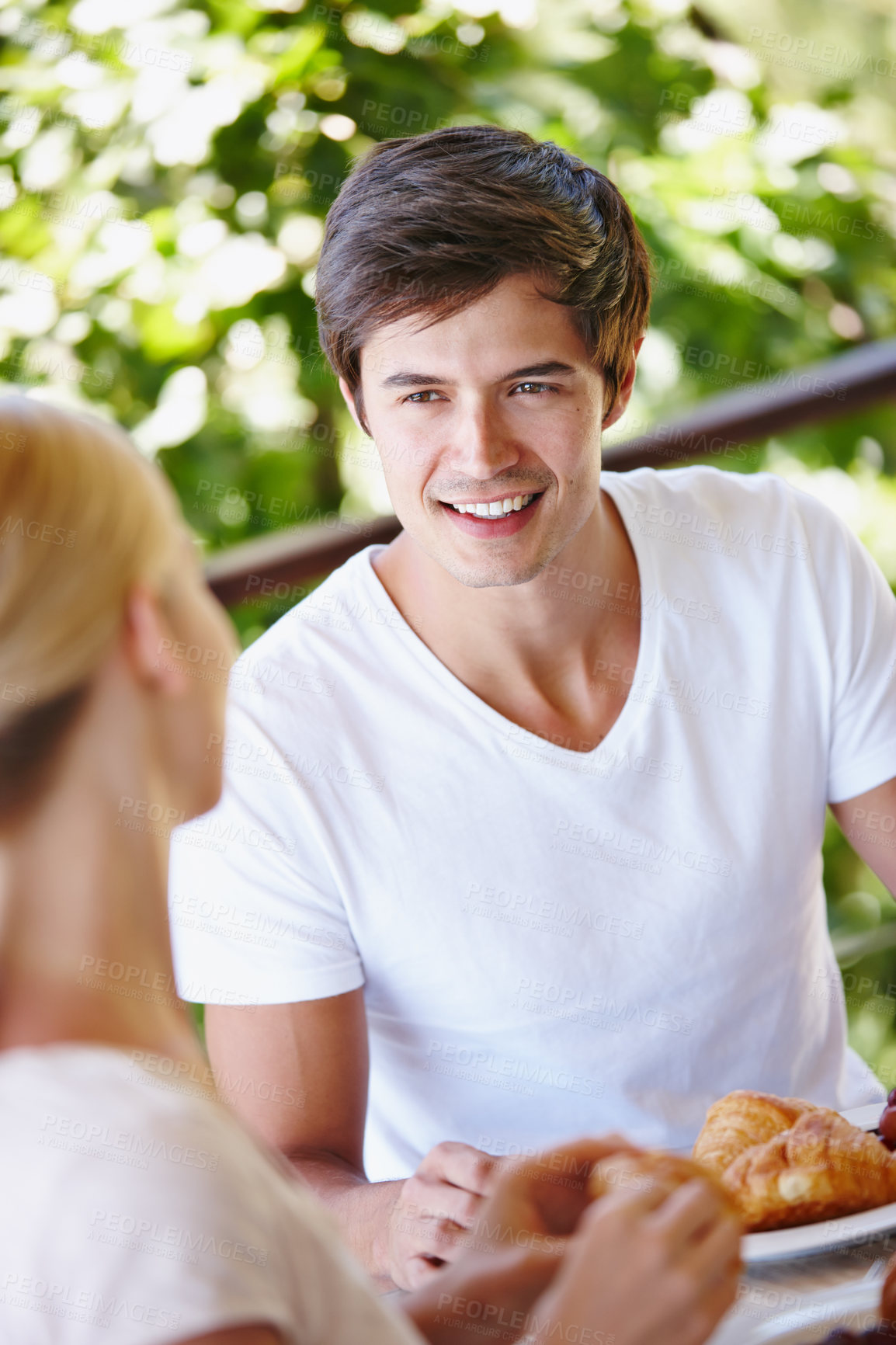 Buy stock photo Balcony, couple and morning with food for breakfast, hungry and bonding together with connection. Outdoor, happy man and woman with nutrition for eating, romance and commitment with smile at home