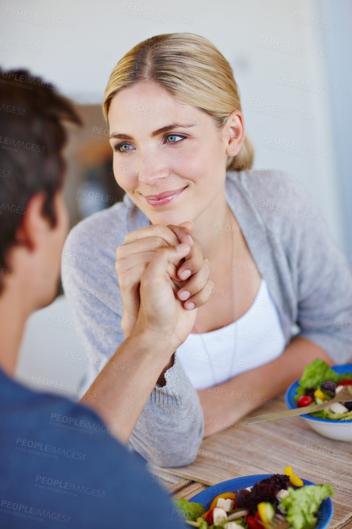 Buy stock photo Salad, couple and home with woman and holding hands with diet, wellness and health food at dining room table. Date, eating and love together with vegetables and lunch with nutrition care and bonding